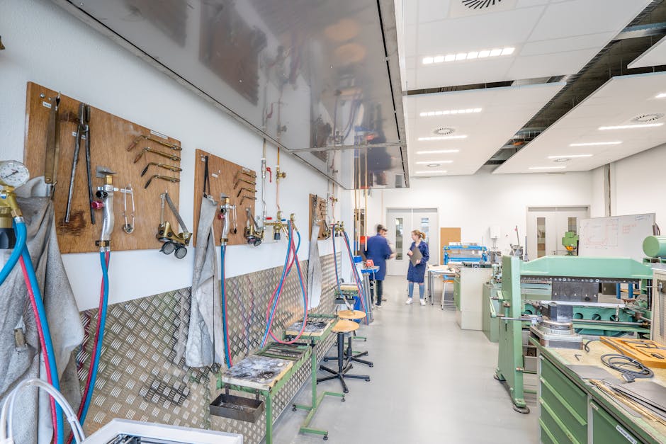 Bright, spacious workshop showcasing machinery and tools for industrial use.